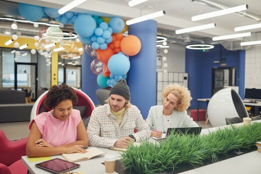 A diverse group of women collaborating in a tech workspace