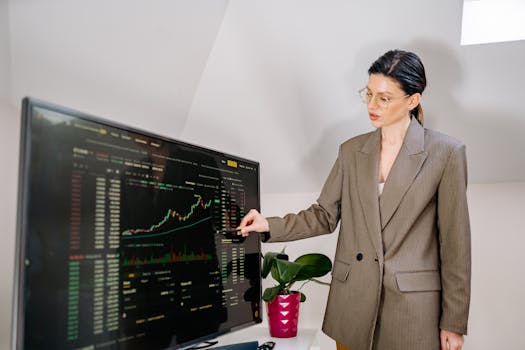 A woman working on a computer with data analytics