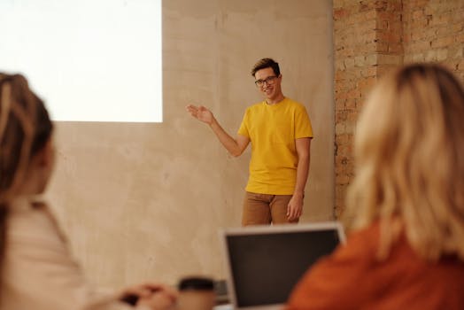 a mentor guiding a young girl in a tech workshop