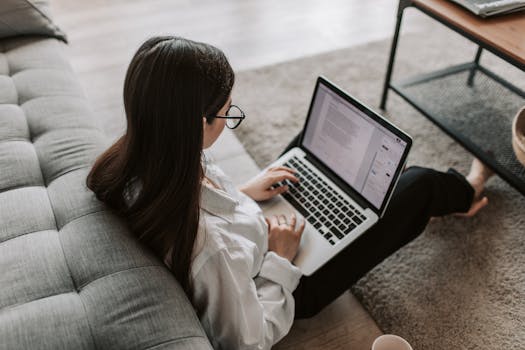 A woman browsing job openings on a laptop