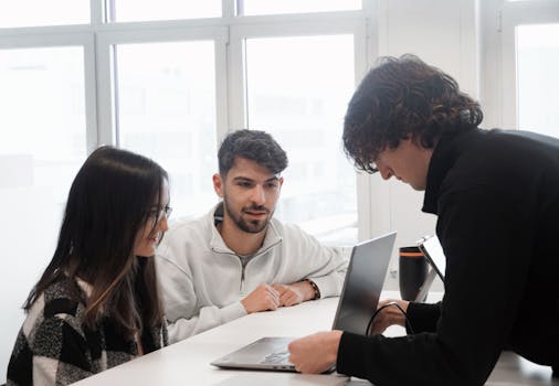 group of women collaborating on a tech project