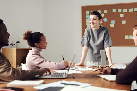 group of women discussing in a tech meeting