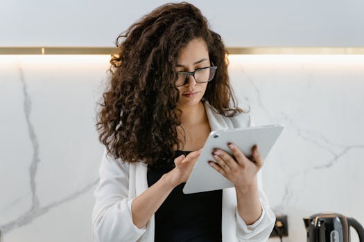 woman reading tech news on tablet