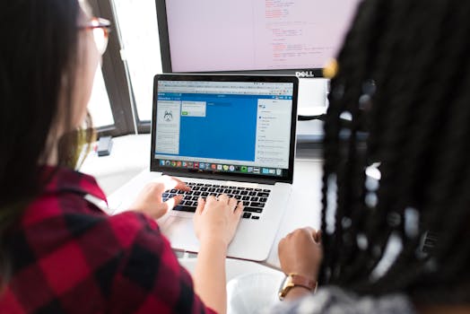 women collaborating in a tech workspace